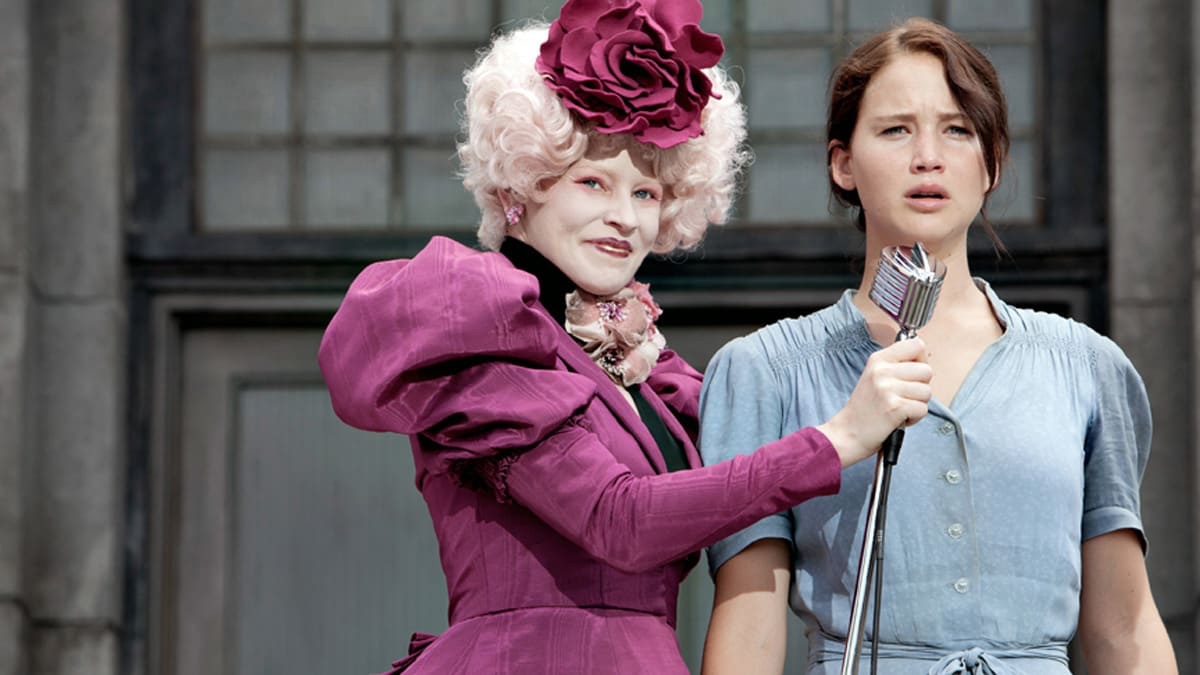 Katniss speaking up with Effie at the first Reaping of the Hunger Games series